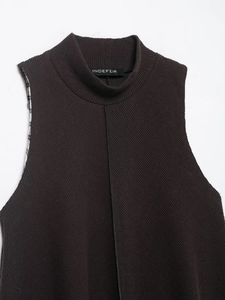 Detail of mock neck knit top in dark coffee color with ribbed texture and plaid accent