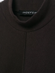 Close-up of ribbed knit texture and neckline label on this dark brown fashion dress