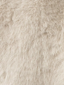 Close-up detail of high-quality faux fur texture on a warm beige women vest