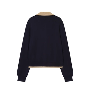 Women's loose knit polo sweater in navy blue with khaki color-block trim back view