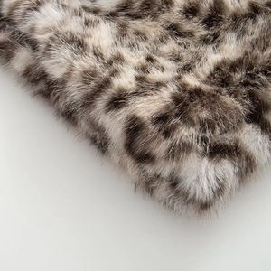 Chic leopard print faux fur coat with thick plush texture and animal pattern design