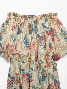 Detail of off-shoulder neckline and puff sleeves on floral ramie bohemian dress
