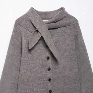 Women's grey knit cardigan coat with scarf collar and dark tortoiseshell buttons