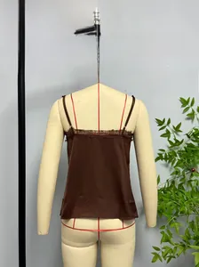 Detail of brown satin camisole featuring delicate eyelash lace trim and thin straps