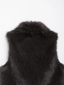 Detailed view of high-density dark brown faux fur back and collar with soft texture