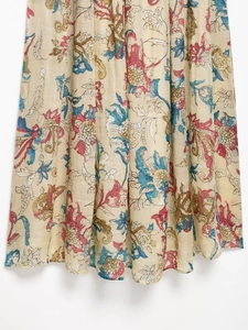 Detailed view of the bohemian floral print and natural ramie fabric on this midi dress