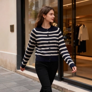 French style striped knit cardigan with navy and white stripes and round neckline