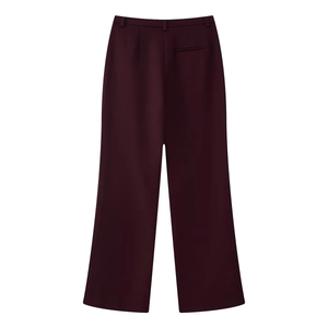Rear view of deep purple high-waisted wide-leg trousers with belt loops and pocket detail