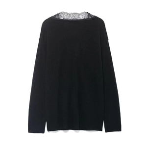 Close-up of elegant black lace embroidery on V-neck wool blend knit sweater top