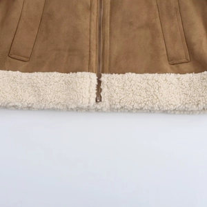 Detail view of winter brown suede jacket with thick white faux fur hem and zip closure