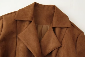 Close-up of caramel faux suede fabric texture and notch lapel on a women jacket