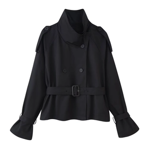 Detail of a black double-breasted cropped trench coat with waist belt and shoulder epaulettes