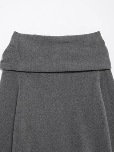 Detailed view of the dark grey ribbed knit texture and off-the-shoulder neckline