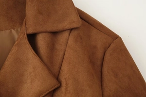 Detailed view of brown faux suede jacket collar and professional shoulder stitching quality