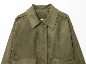 Macro detail of army green suede jacket showing lapel collar and shoulder epaulettes