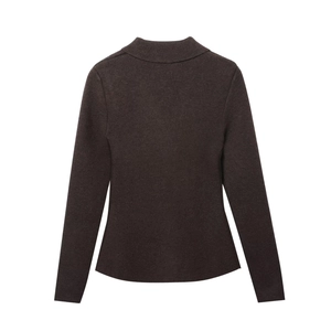 Detail of dark brown knit blazer featuring fine ribbed texture and elegant slim fit cut