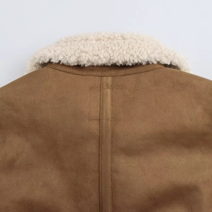 Detail of premium brown faux suede jacket back with white shearling collar and stitching