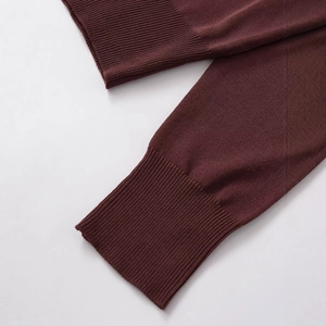 Women's burgundy wool blend pullover knit sweater with detailed ribbed cuffs texture