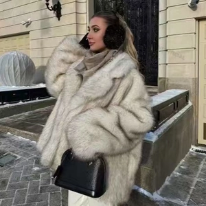 Elegant oversized faux fur coat with lapels in cream white for winter street style