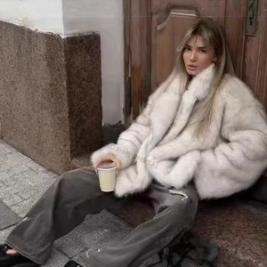 Elegant oversized white faux fur coat with lapels and long fluffy texture for women