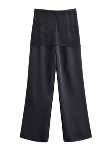 Detailed view of black satin high waist trousers featuring delicate floral lace inserts