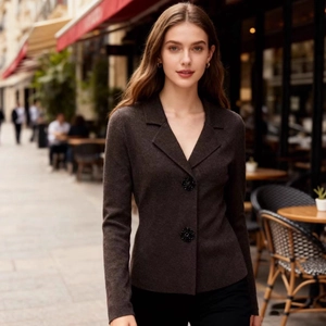 Dark brown knit blazer featuring ornate floral buttons in a street style outdoor setting