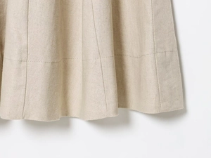 Detailed close-up showing texture and hem of the oatmeal linen blend square neck midi dress