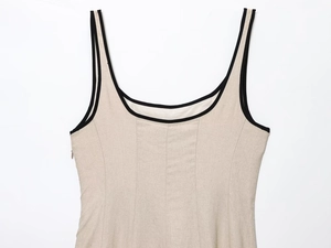 Detail view of linen blend midi dress showing square neck with black contrast piping