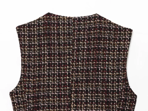 Detailed macro view of the multicolor tweed fabric with intricate woven texture and stitching