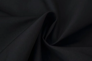 Macro shot showing the premium black twill fabric texture and fine diagonal weave detail