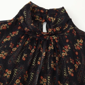 Black floral paisley dress with high ruffle neck and bubble chiffon fabric detail