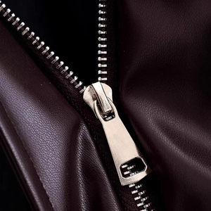 Deep brown faux leather jacket with high-quality gold metal zipper and stand collar detail