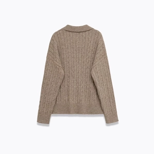 Oatmeal cable-knit sweater with a turn-down collar and relaxed back view design