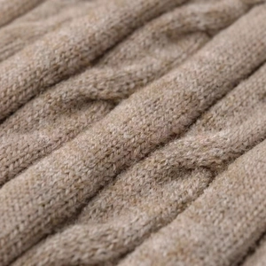 Oatmeal cable knit sweater with chunky wool texture for casual autumn layering