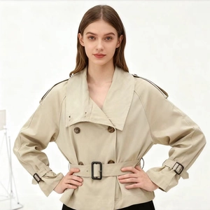 Classic double-breasted short trench coat with waist belt and wide lapels in khaki finish