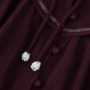 Burgundy beaded blouse with vertical stripes, white wavy embroidery, and button-up detail