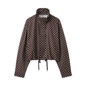 Detailed flat lay of brown polka dot jacket showing stand collar and adjustable drawstring