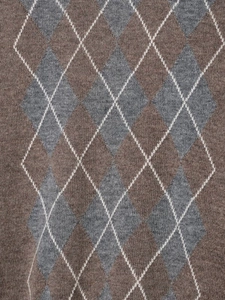 Close-up of argyle knit pattern fabric in brown and grey tones for a cozy winter sweater