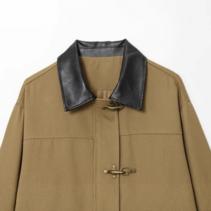 Khaki canvas workwear jacket featuring black leather collar and vintage metal hook buckles