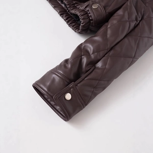 Deep brown quilted faux leather jacket with turn-down collar and silver metallic button details