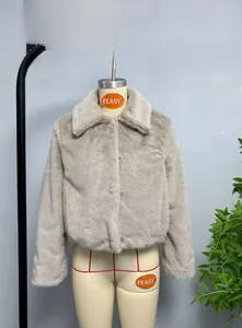 Detail shot of the plush faux fur texture and lapel design on this grey cropped jacket