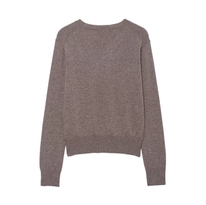 Detail of coffee brown knit sweater showing ribbed cuffs and fine diamond stitch texture