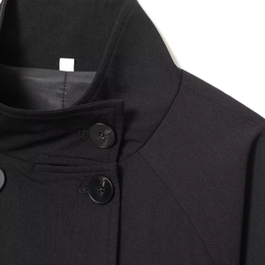 Classic black wool-blend windbreaker coat featuring a high collar and large round buttons