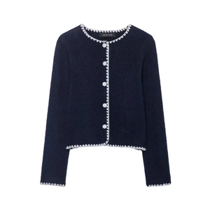 Navy blue knit cardigan with white scalloped trim and button-up front on white background