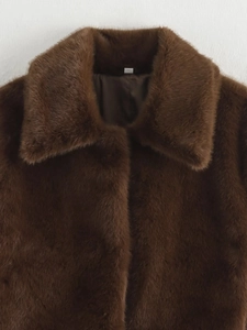 Close-up of deep brown faux fur collar with high-quality texture and smooth satin lining
