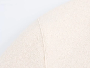 Macro detail of high-quality beige wool fabric texture with fine vertical stitching line