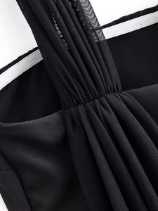 Detail shot of black mesh layering with fine pleats and reinforced nonslip lining edge