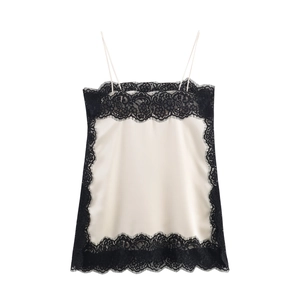 Elegant white satin camisole top with intricate black lace trim and thin shoulder straps
