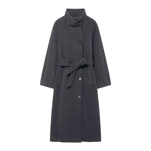 Detail view of a long dark grey coat featuring a high neck collar and wide waist belt tie