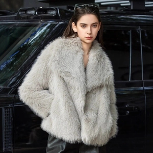 Faux fur short jacket in light grey with oversized lapels on fashion model